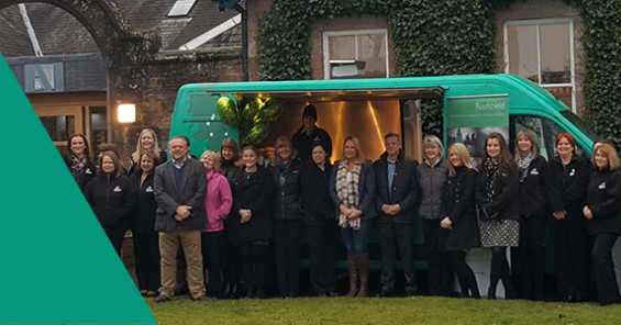 Members of the A.Proctor Group team gather outside their UK tour van