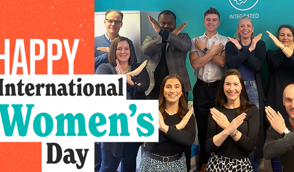 Members of the Fabrick team celebrate International Women's Day by creating the symbol for #BreakingTheBias